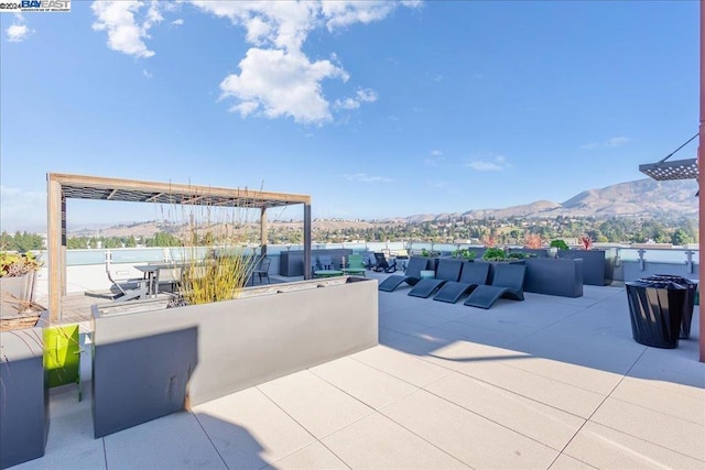 view of patio / terrace with a mountain view