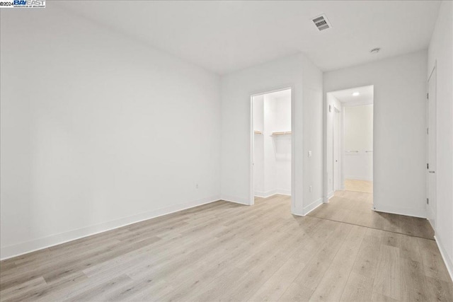 unfurnished room featuring light hardwood / wood-style floors