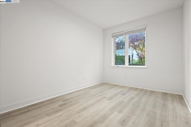 spare room with light wood-type flooring