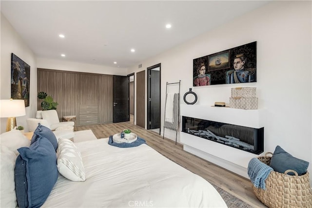 bedroom with light hardwood / wood-style floors