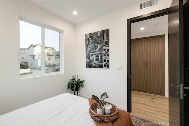 bedroom featuring hardwood / wood-style floors