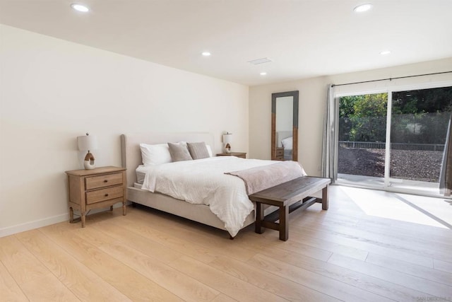 bedroom with access to outside and light hardwood / wood-style flooring