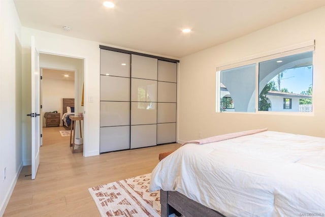 bedroom featuring light wood-type flooring