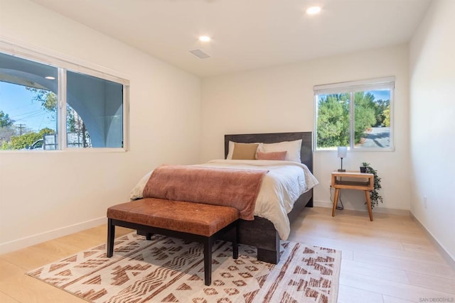 bedroom with light hardwood / wood-style floors