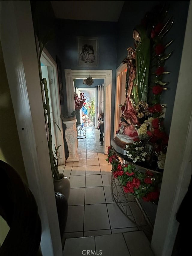 hallway featuring light tile patterned floors