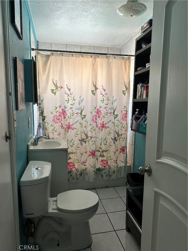 full bathroom with sink, shower / tub combo, a textured ceiling, tile patterned floors, and toilet