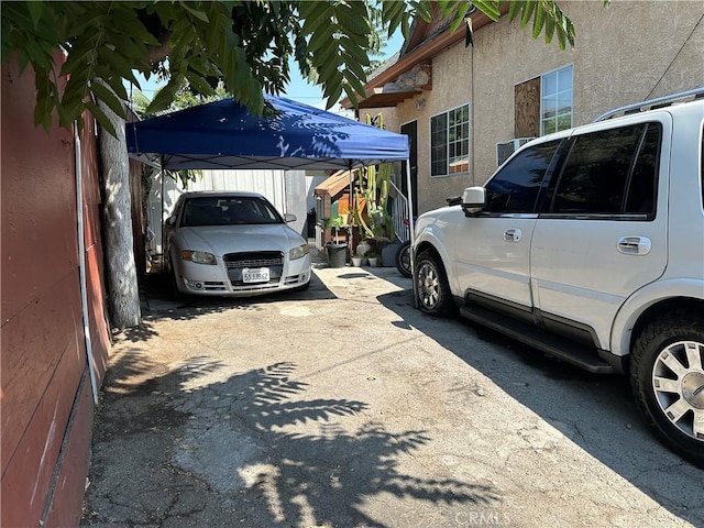 view of side of home featuring a carport