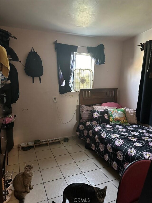 bedroom featuring light tile patterned flooring