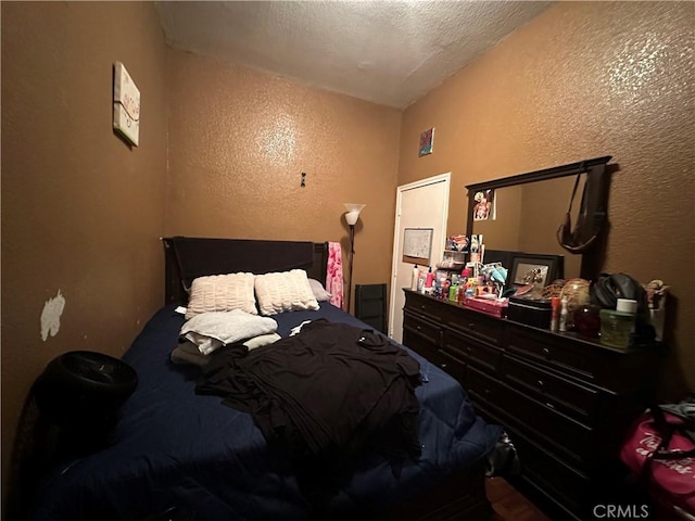 bedroom featuring a textured ceiling