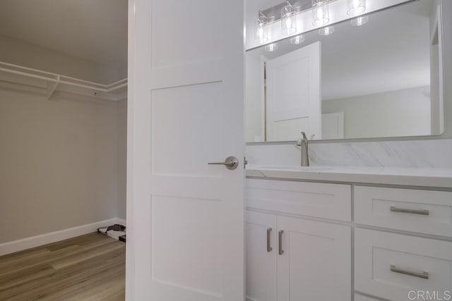 bathroom featuring vanity and wood-type flooring