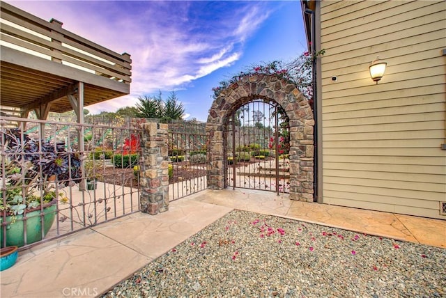 view of patio terrace at dusk