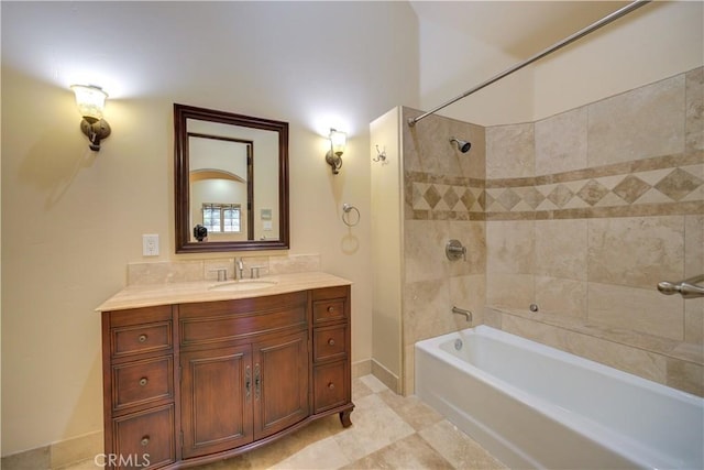 bathroom featuring vanity, tiled shower / bath combo, and tile patterned floors