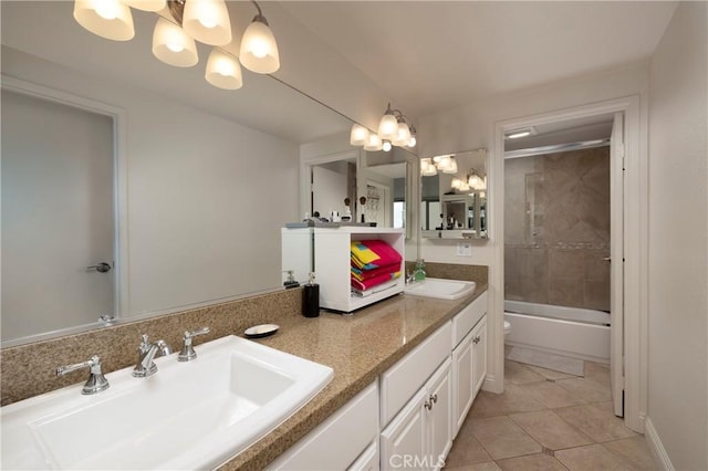 full bathroom featuring an inviting chandelier, tile patterned flooring, bath / shower combo with glass door, toilet, and vanity