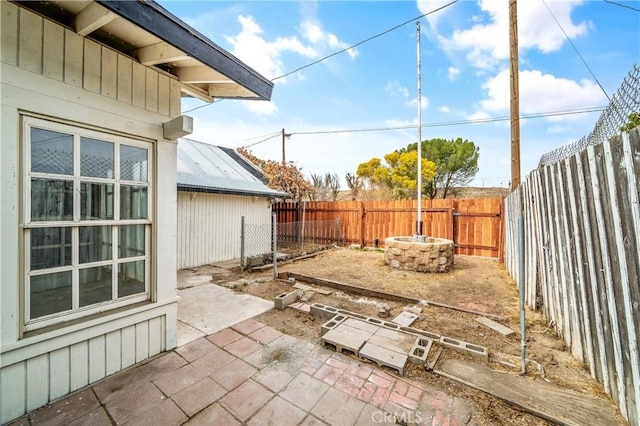 view of patio / terrace featuring a fire pit