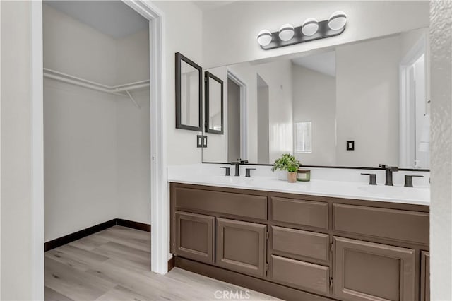 bathroom featuring vanity and hardwood / wood-style floors