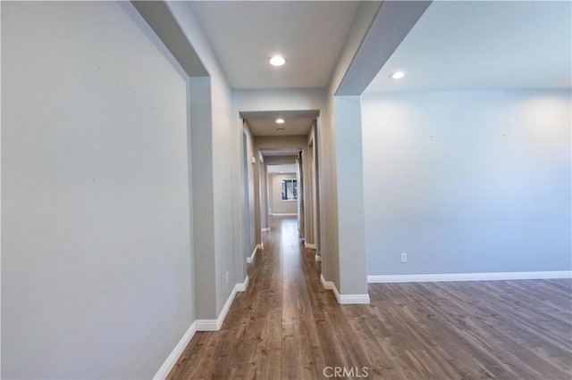 corridor with wood-type flooring