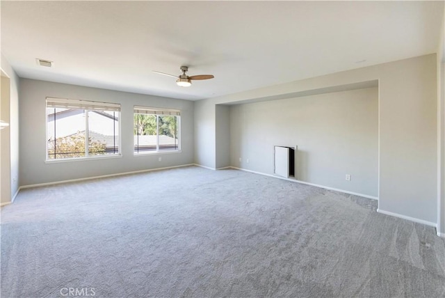 carpeted empty room with ceiling fan