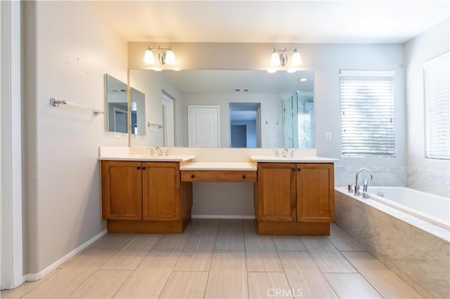 bathroom featuring vanity and shower with separate bathtub