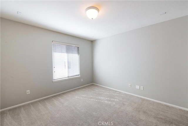 empty room featuring light carpet