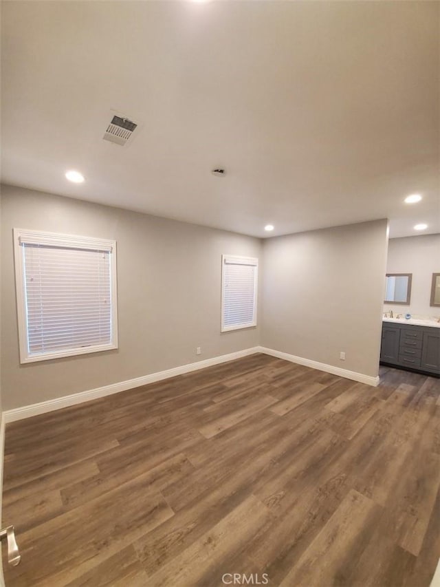 empty room with dark wood-type flooring