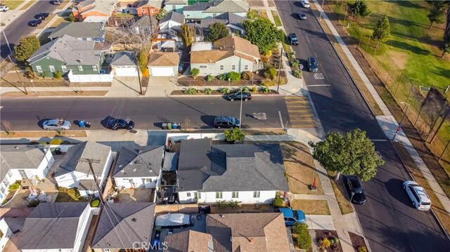 birds eye view of property with a residential view