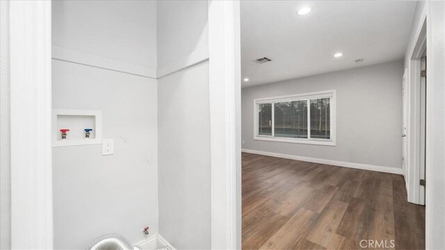 laundry area with laundry area, visible vents, wood finished floors, hookup for a washing machine, and recessed lighting