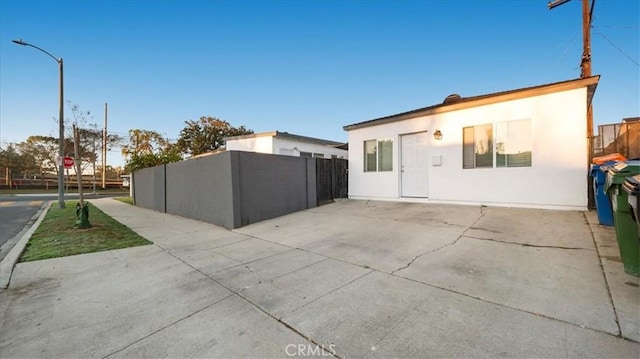 exterior space with a patio area and stucco siding