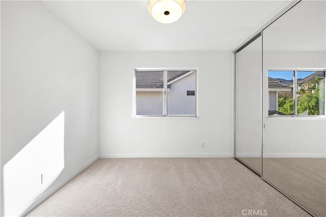 unfurnished room featuring carpet flooring