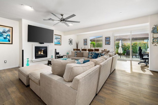 living room with hardwood / wood-style flooring and ceiling fan