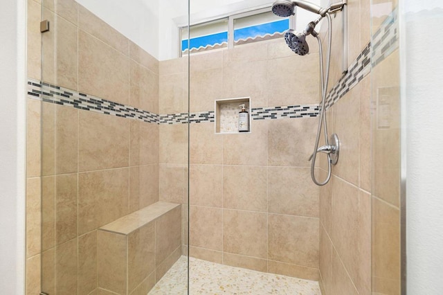 bathroom featuring tiled shower