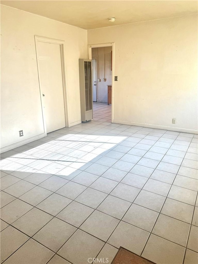 empty room with light tile patterned flooring