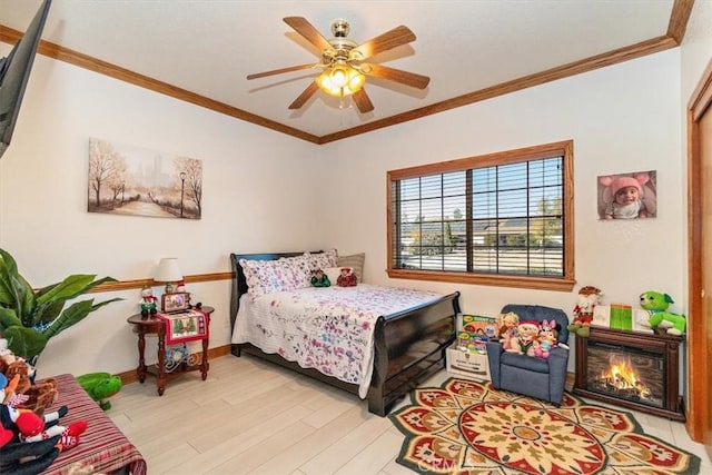 bedroom featuring ceiling fan, light hardwood / wood-style floors, and ornamental molding