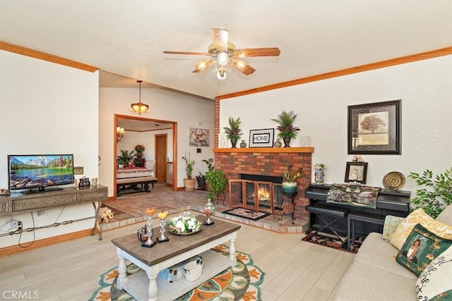 19985 Red Feather Rd, Apple Valley, CA 92307 - living room with crown molding, ceiling fan, wood finished floors, and a fireplace