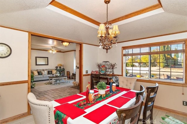 19985 Red Feather Rd, Apple Valley, CA 92307 - dining area featuring a tray ceiling, a chandelier, crown molding, and tile patterned floors