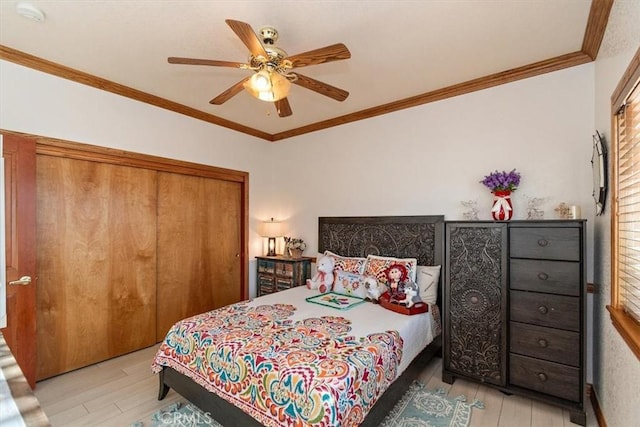19985 Red Feather Rd, Apple Valley, CA 92307 - bedroom featuring wood finished floors, a closet, ornamental molding, and ceiling fan