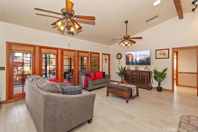 living room with lofted ceiling with beams, light hardwood / wood-style floors, and ceiling fan