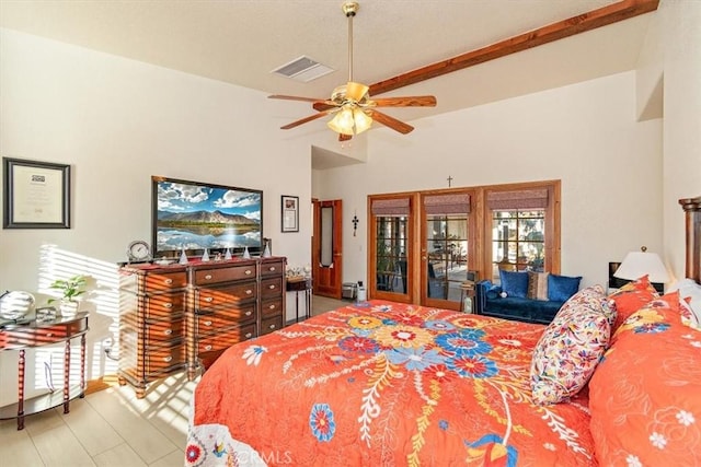 bedroom with ceiling fan, beam ceiling, access to exterior, and a towering ceiling