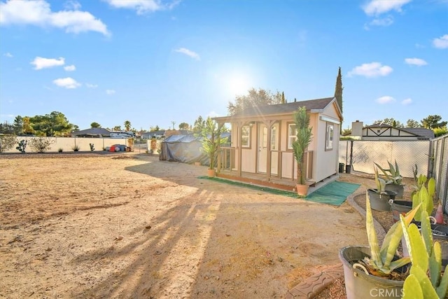19985 Red Feather Rd, Apple Valley, CA 92307 - rear view of house with a fenced backyard and an outbuilding