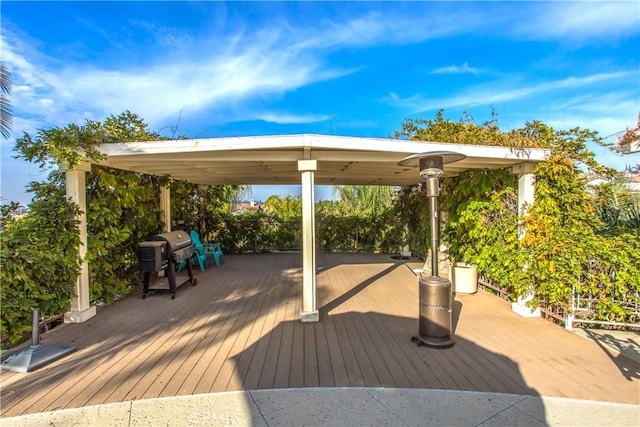 wooden terrace with a gazebo and grilling area