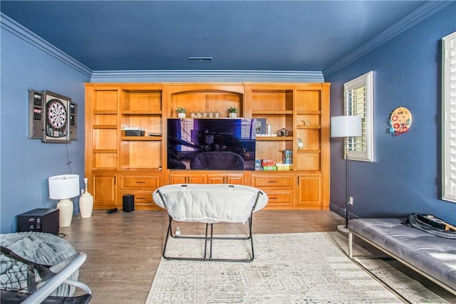 living room featuring dark hardwood / wood-style flooring and crown molding