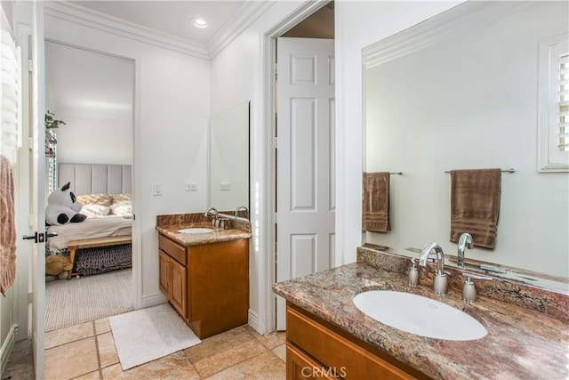 bathroom with vanity and ornamental molding