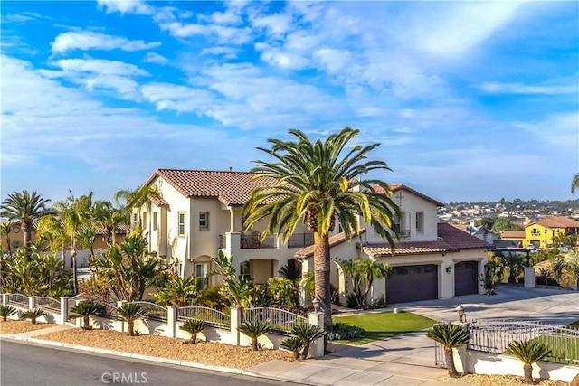 mediterranean / spanish-style home featuring a garage