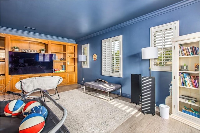 interior space featuring light hardwood / wood-style flooring and ornamental molding