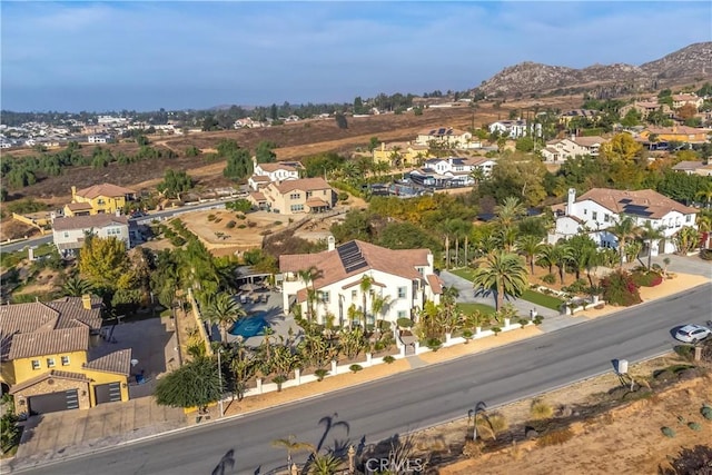 birds eye view of property featuring a mountain view