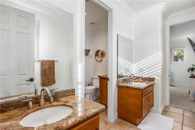 bathroom featuring tile patterned floors, toilet, vanity, and ornamental molding