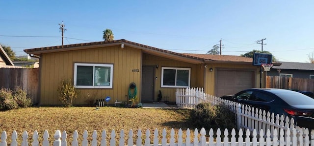 ranch-style home featuring a garage