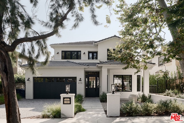 view of front of property with a garage