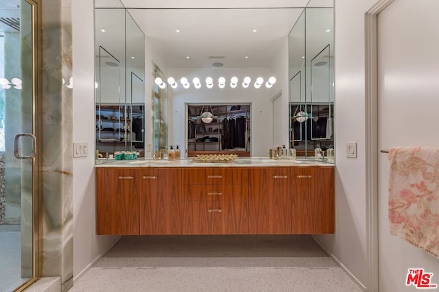 bathroom with vanity and an enclosed shower