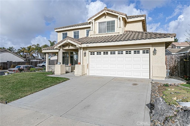 view of property featuring a front yard and a garage