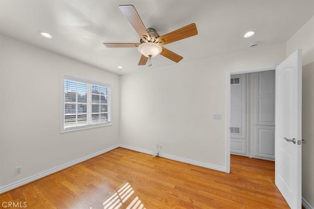 spare room with recessed lighting, visible vents, light wood-type flooring, and baseboards